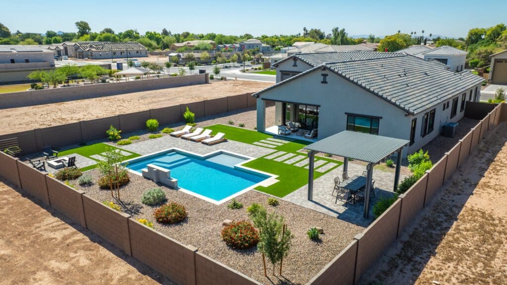 Aerial view of Acoma Estates Lot 7 backyard with private pool, turf and pergola